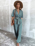 CHICMY- Plunging Neck Allover Floral Print Belted Jumpsuit