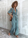 CHICMY- Plunging Neck Allover Floral Print Belted Jumpsuit